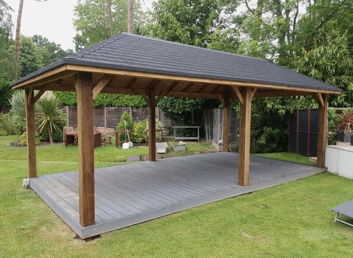 Timber pergola with a tiled roof over grey decking